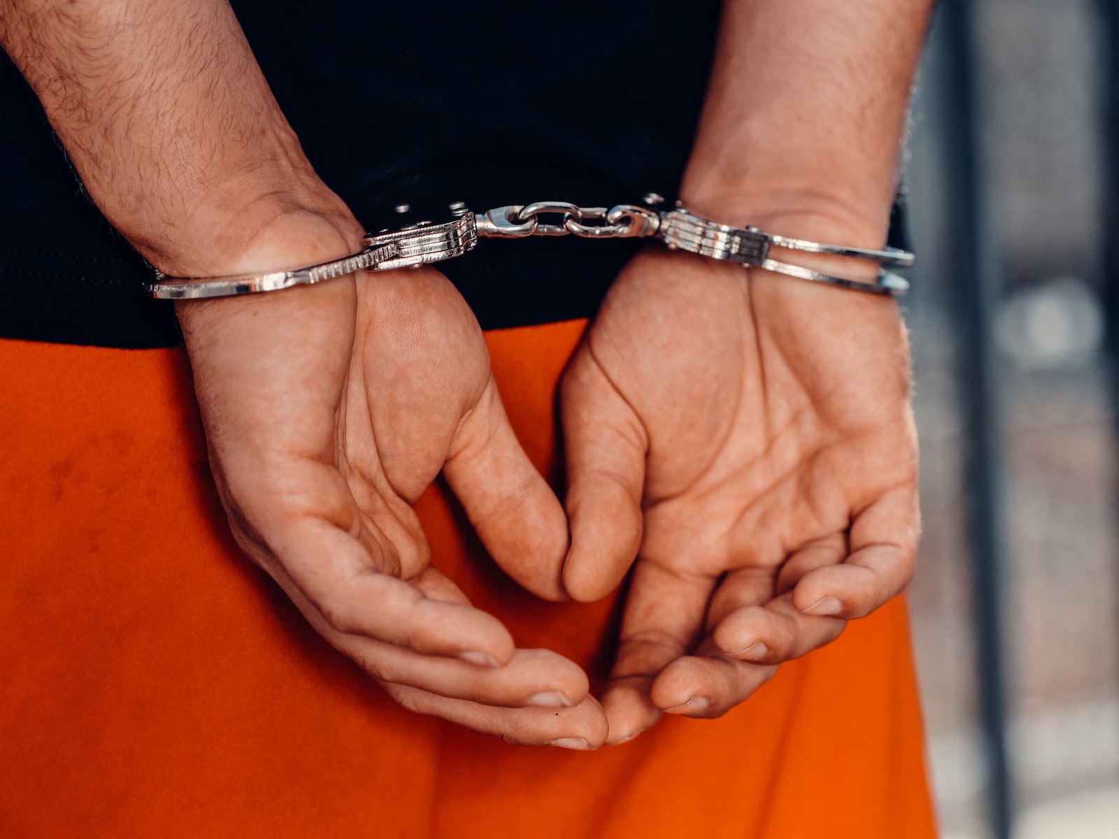 Close-Up Shot of a Person with Handcuffs